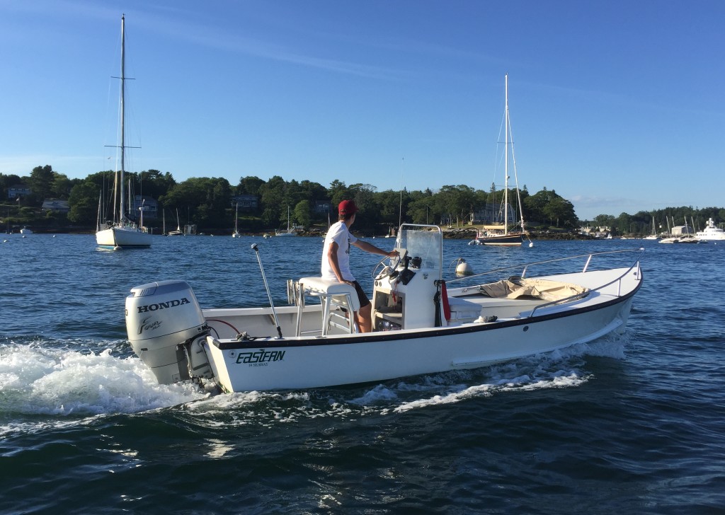 The Eastern 19 Center Console with dodger folded down, crossing Boothbay Harbor